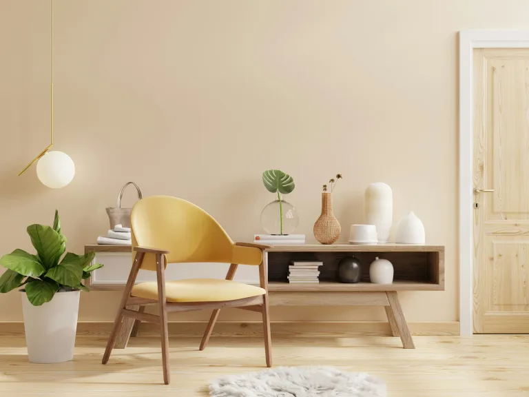 Világos, bézs falú nappali részlet, amely egy ingatlanhirdetéshez készült profi, vonzó fotót szemléltet.